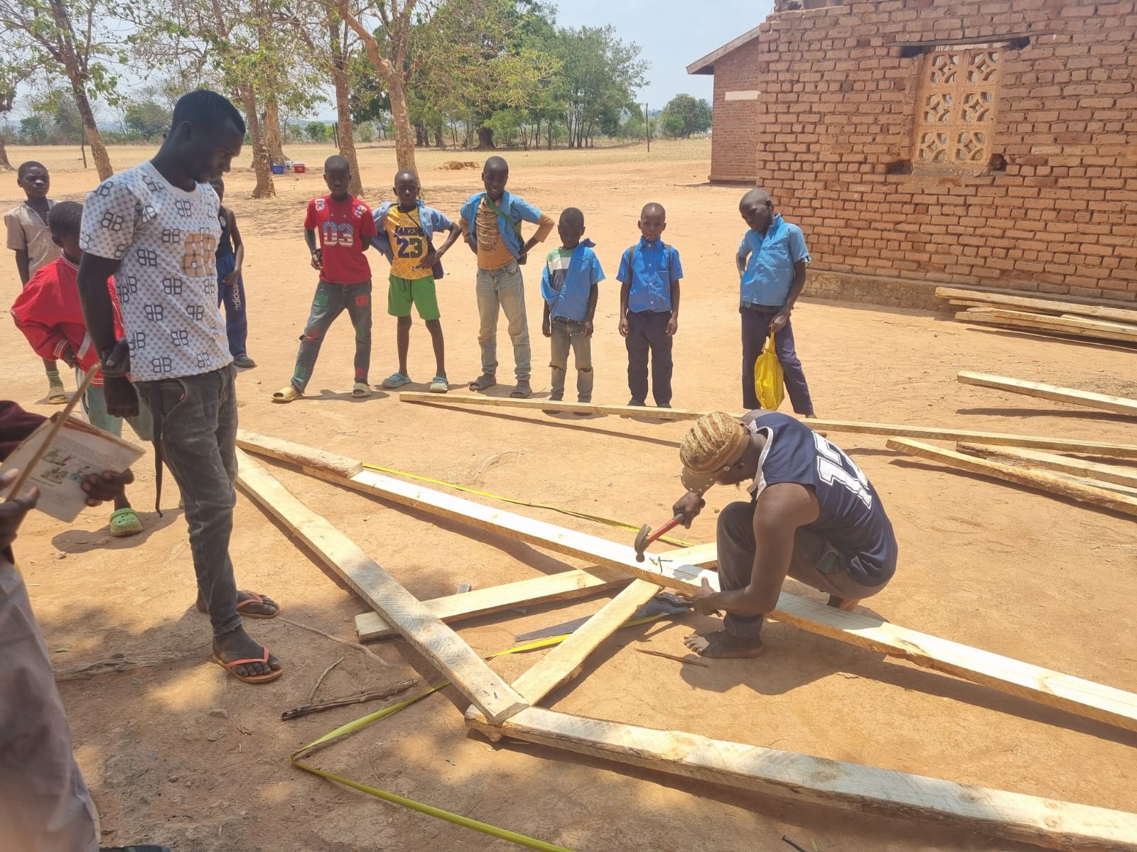 Community members working on building materials